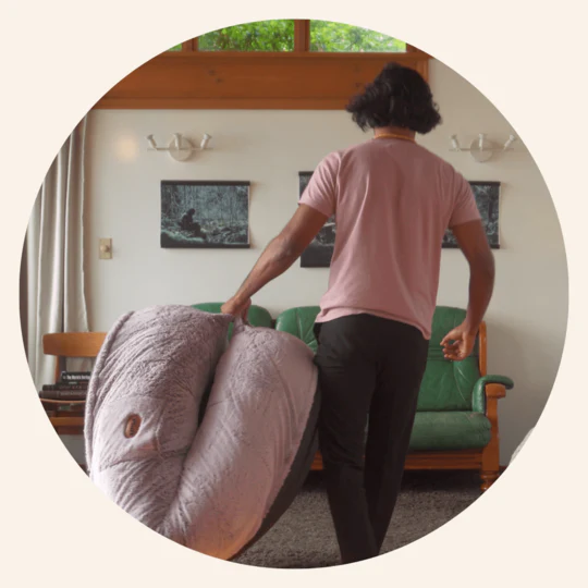 Portable Plufl human dog bed with built-in handles for easy storage